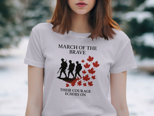 Person wearing a lavender t-shirt with a graphic design and text in a snowy outdoor setting