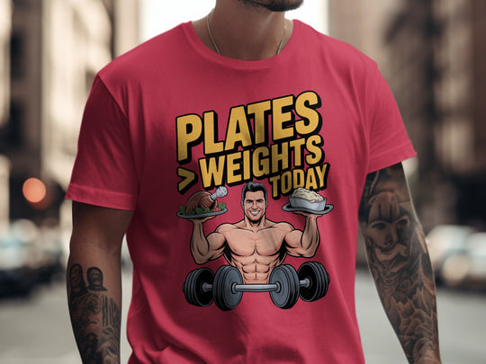 Person wearing a red t-shirt with a graphic design and text in an urban setting