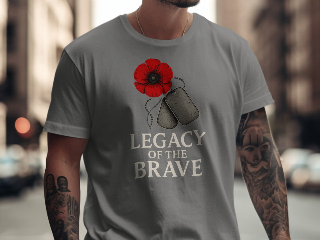 Person wearing a charcoal t-shirt with a red poppy and dog tags design and 'Legacy of the Brave' text.