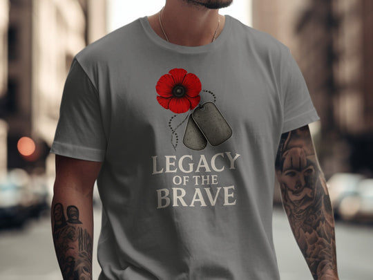 Person wearing a charcoal t-shirt with a red poppy and dog tags design and 'Legacy of the Brave' text.