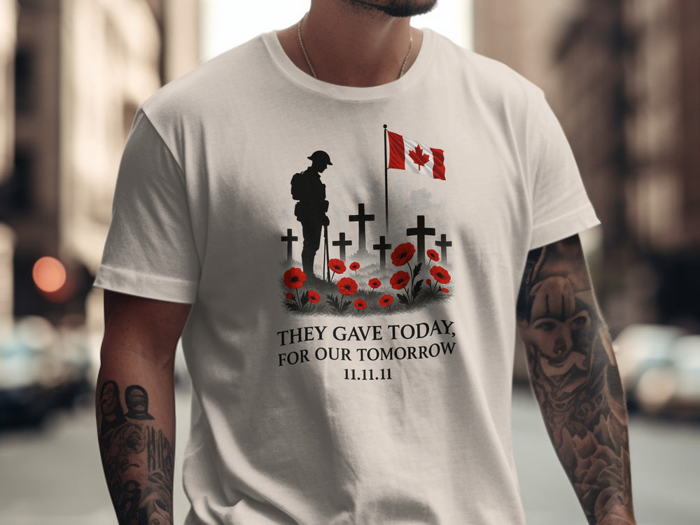 Person wearing a natural color t-shirt with a military-themed design featuring crosses, a flag, and text.