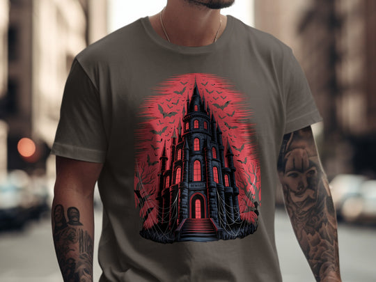 Person wearing a dark chocolate t-shirt with a castle design in red and black.