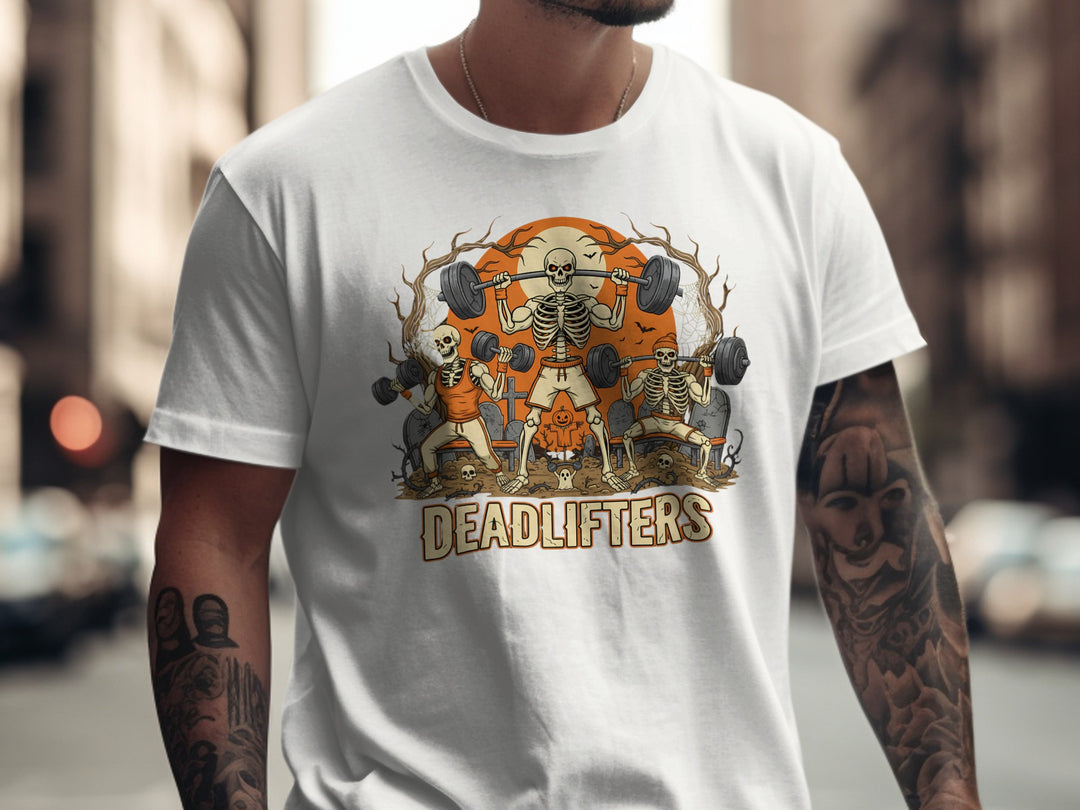 Person wearing a white t-shirt with a graphic design of skeletons lifting weights and the word 'DEADLIFTERS'.