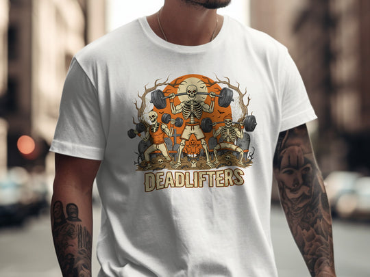 Person wearing a white t-shirt with a graphic design of skeletons lifting weights and the word 'DEADLIFTERS'.