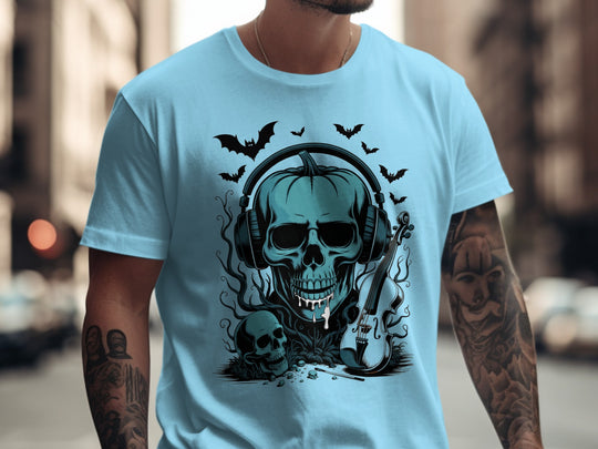 Person wearing a sky blue t-shirt with a skull and guitar design in an urban setting