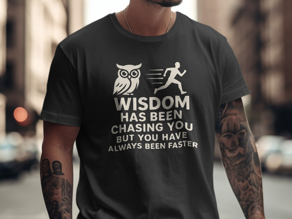 Person wearing a black t-shirt with an owl and running person graphic and text.