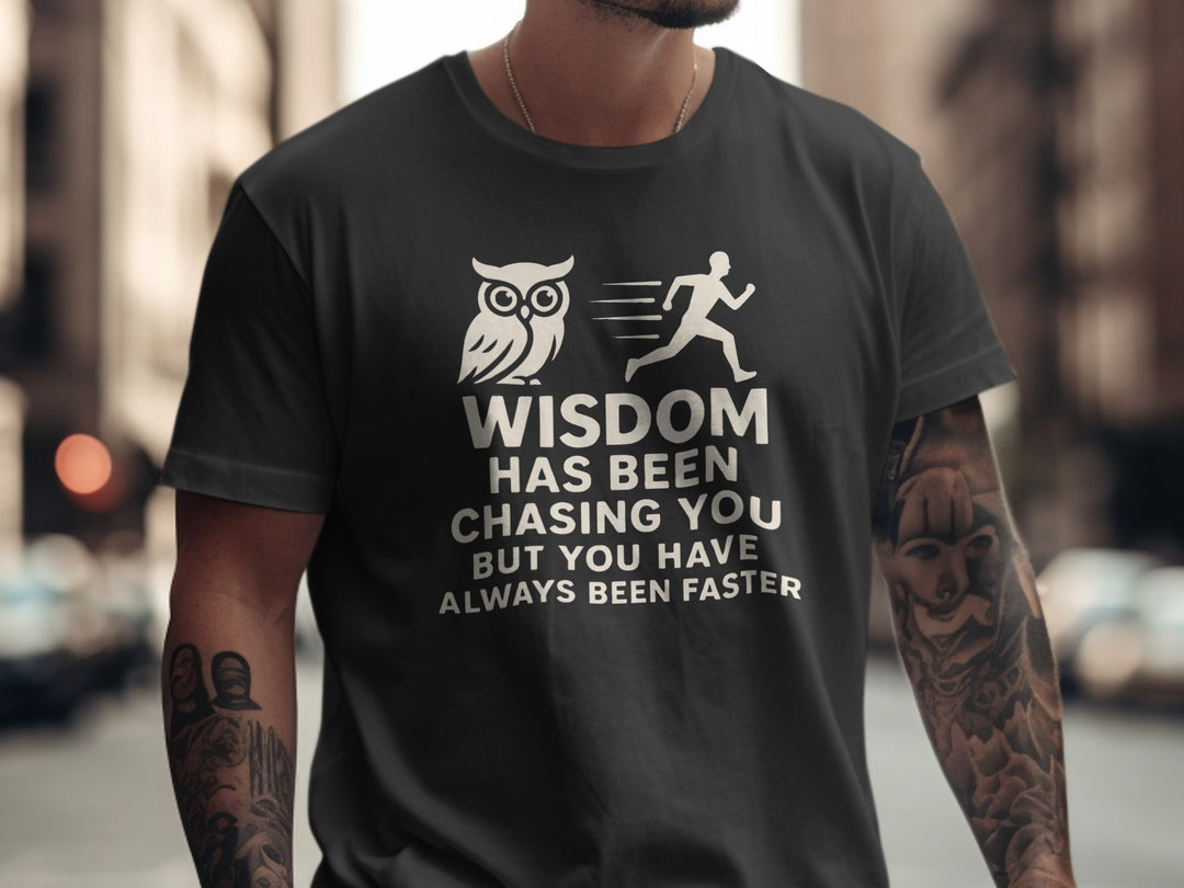 Person wearing a black t-shirt with an owl and running person graphic and text.
