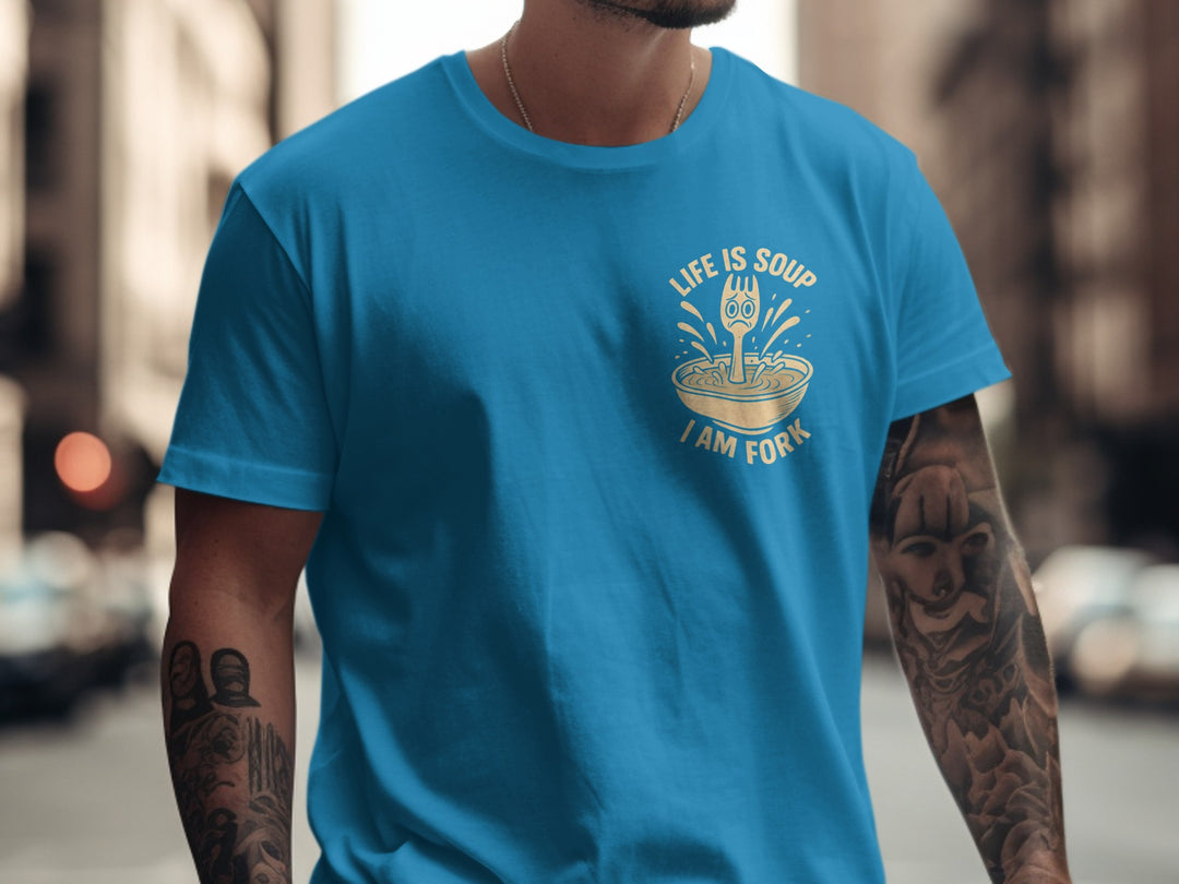 Person wearing a sapphire blue t-shirt with a graphic design and text.