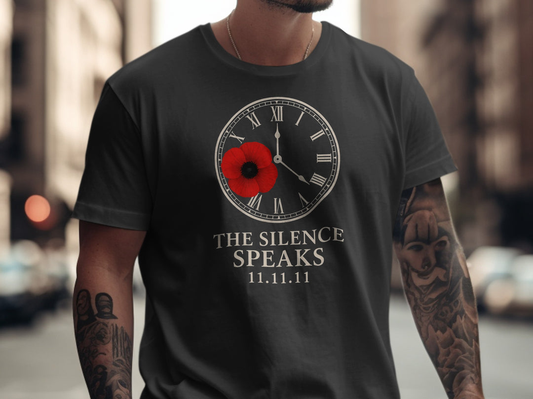 Person wearing a black t-shirt with a clock and poppy design, text 'The Silence Speaks 11.11.