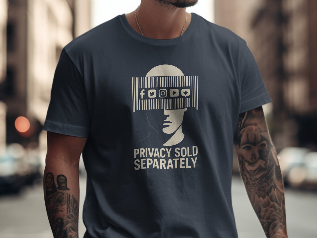 Person wearing a navy blue t-shirt with a graphic design and text on a blurred city street background