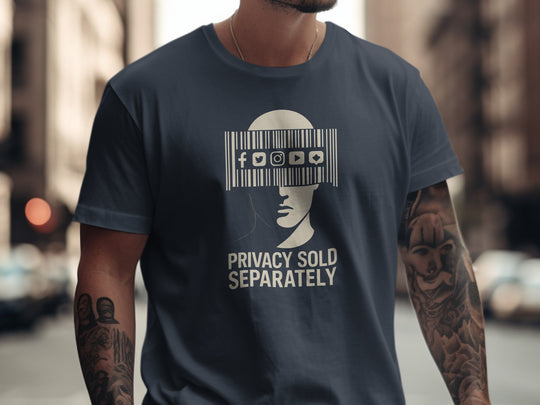 Person wearing a navy blue t-shirt with a graphic design and text on a blurred city street background