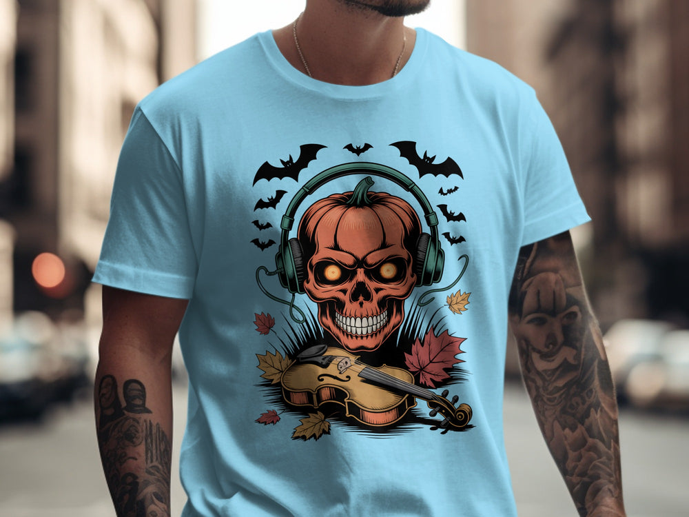 Person wearing a sky blue t-shirt with a Halloween-themed design featuring a skull, pumpkins, and a violin.