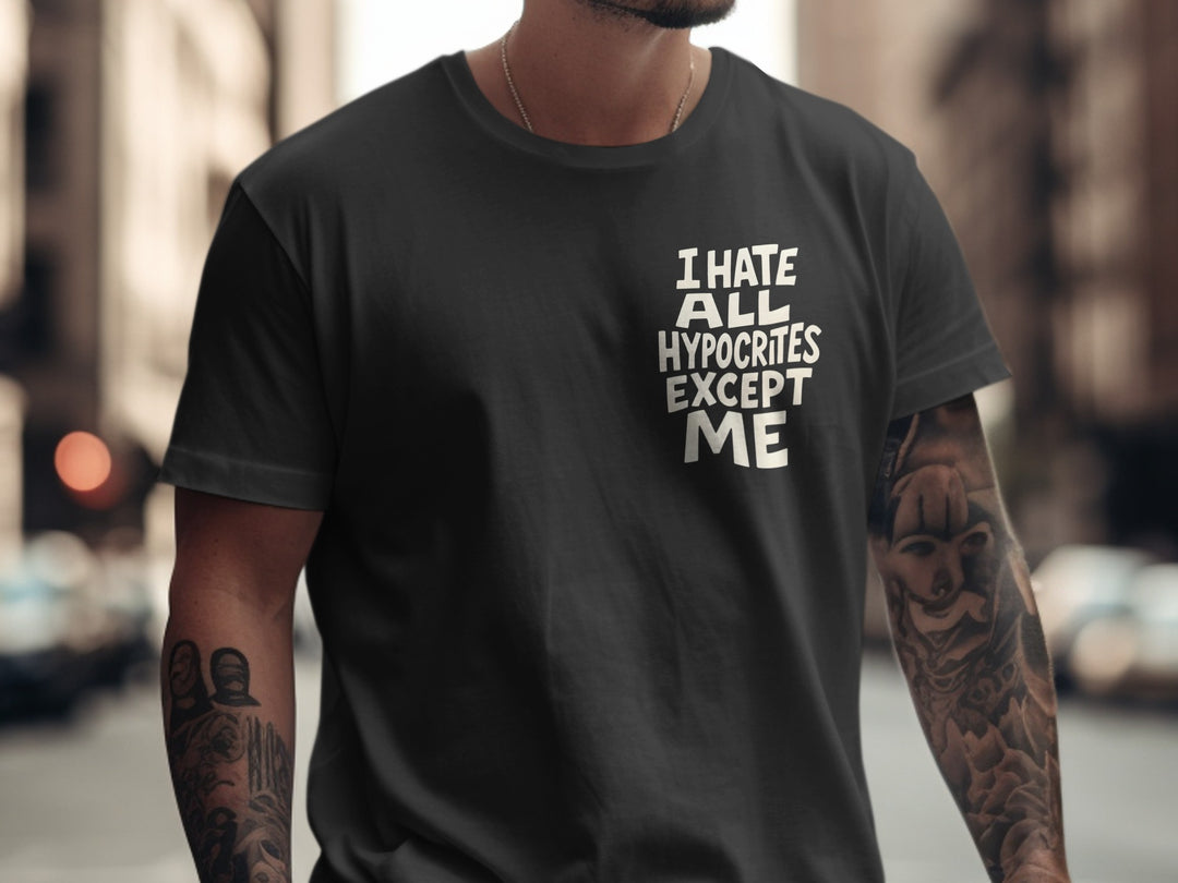 Person wearing a black t-shirt with text 'I HATE ALL HYPOCRITES EXCEPT ME' on a blurred city street background.