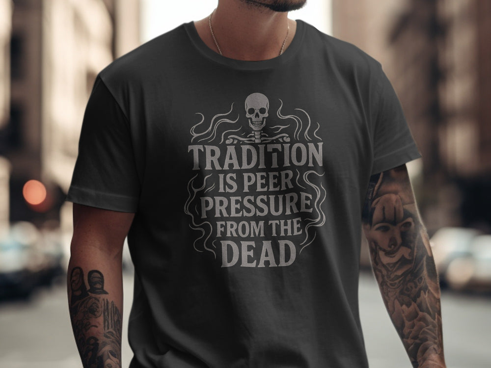 Person wearing a black t-shirt with a skull design and text in an urban setting