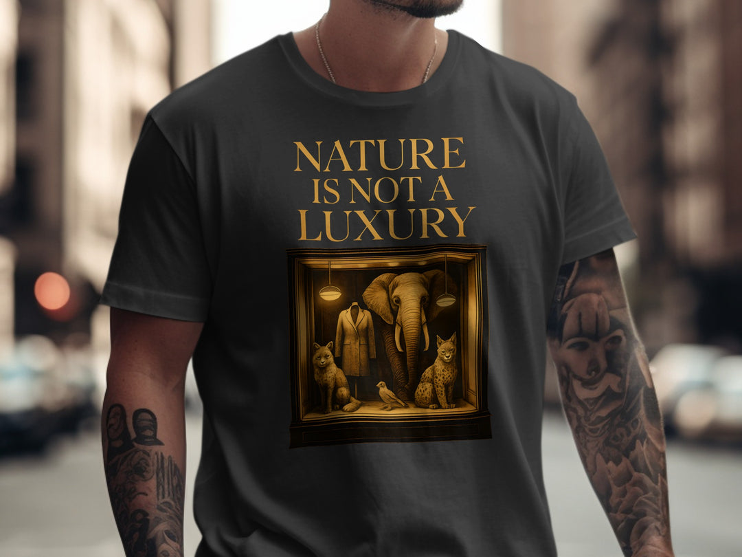 Person wearing a black t-shirt with 'Nature is not a Luxury' text and an elephant and lion illustration.