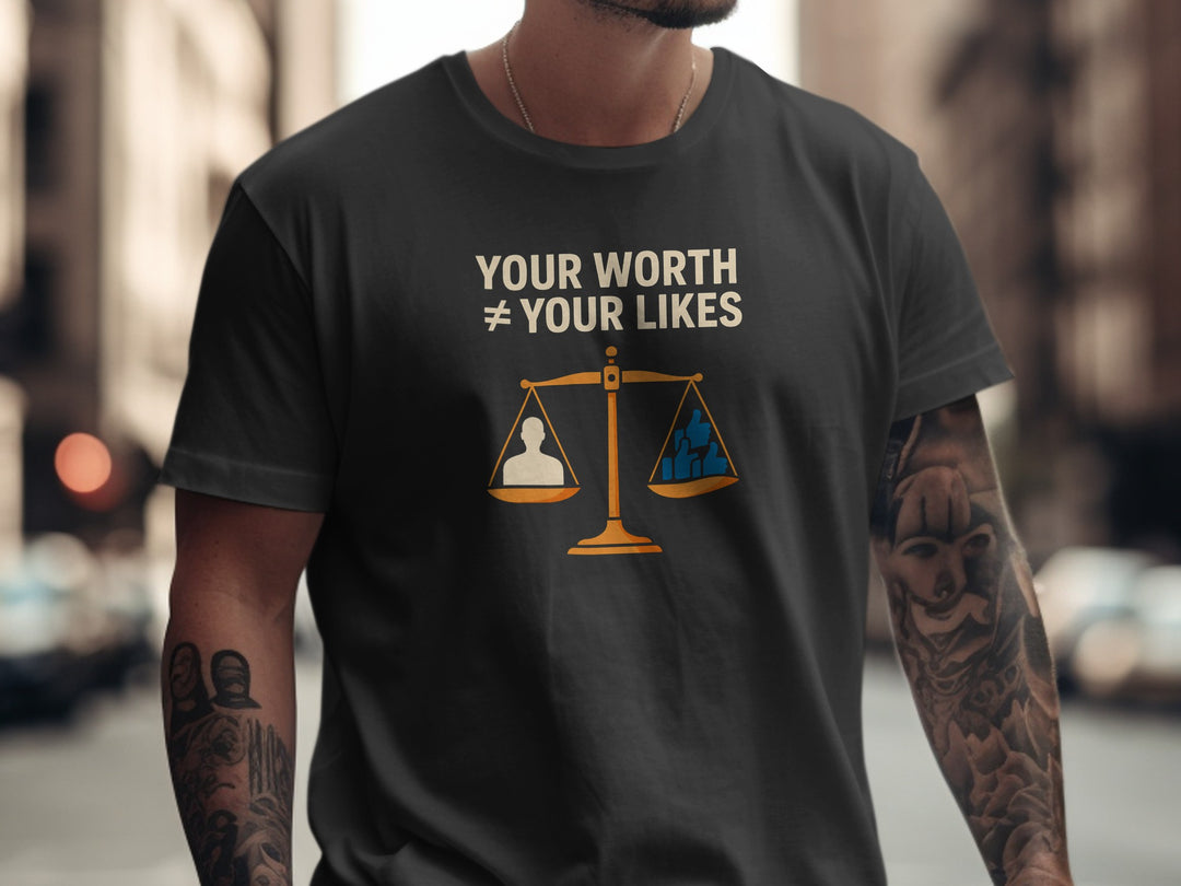 Person wearing a black t-shirt with a message and graphic design.