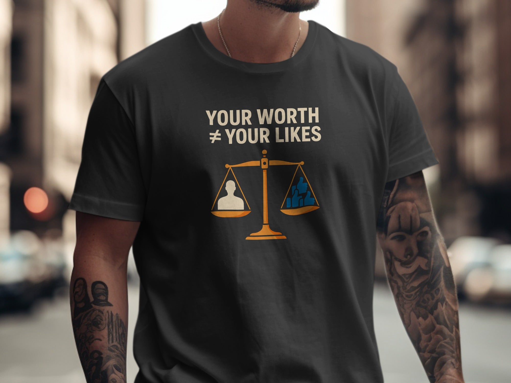 Person wearing a black t-shirt with a message and graphic design.