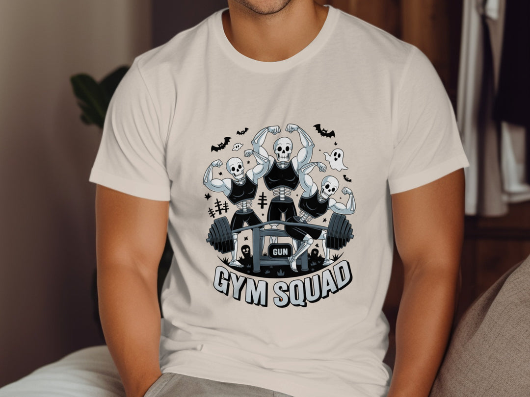 Person wearing a natural color t-shirt with 'Gym Squad' graphic design.
