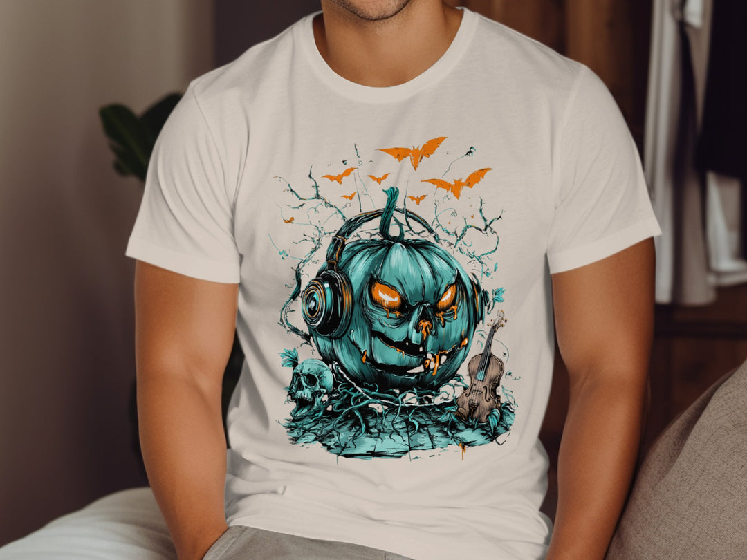 Person wearing a natural color t-shirt with a teal pumpkin graphic and headphones design.