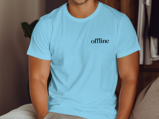 Person wearing a sky blue t-shirt with 'offline' text.