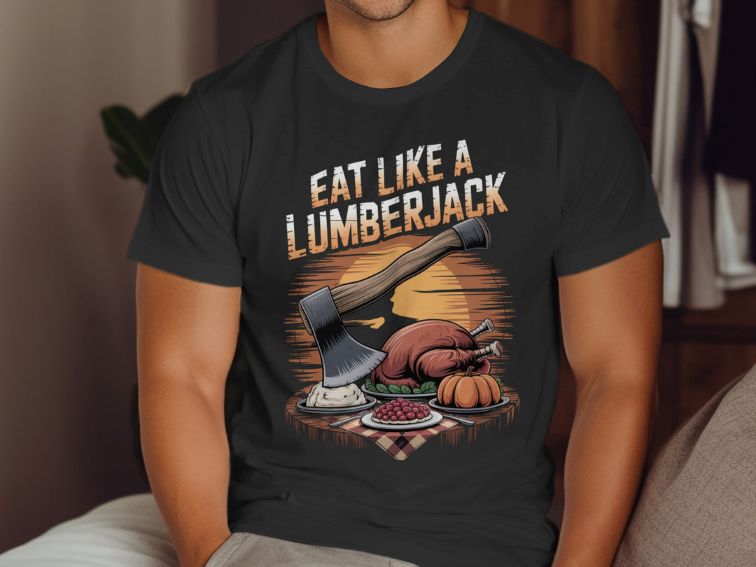 Person wearing a black t-shirt with a graphic design and text 'Eat Like a Lumberjack'.