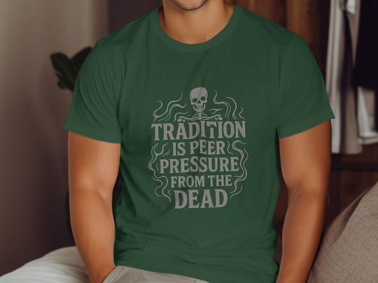 Person wearing a green t-shirt with a skull design and text.