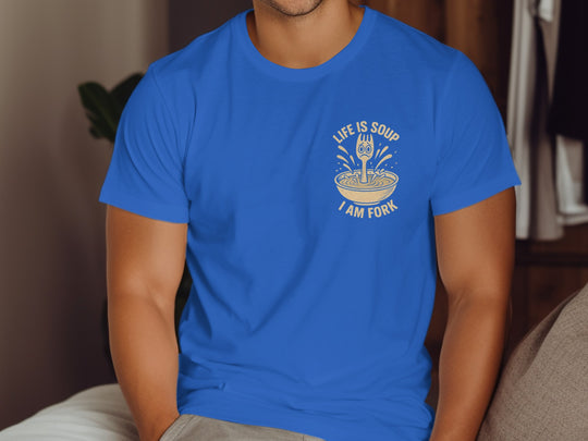 Person wearing a blue t-shirt with a graphic design and text.