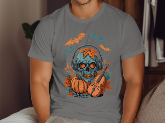 Person wearing a charcoal t-shirt with a Halloween-themed design featuring a skull, pumpkin, and violin.