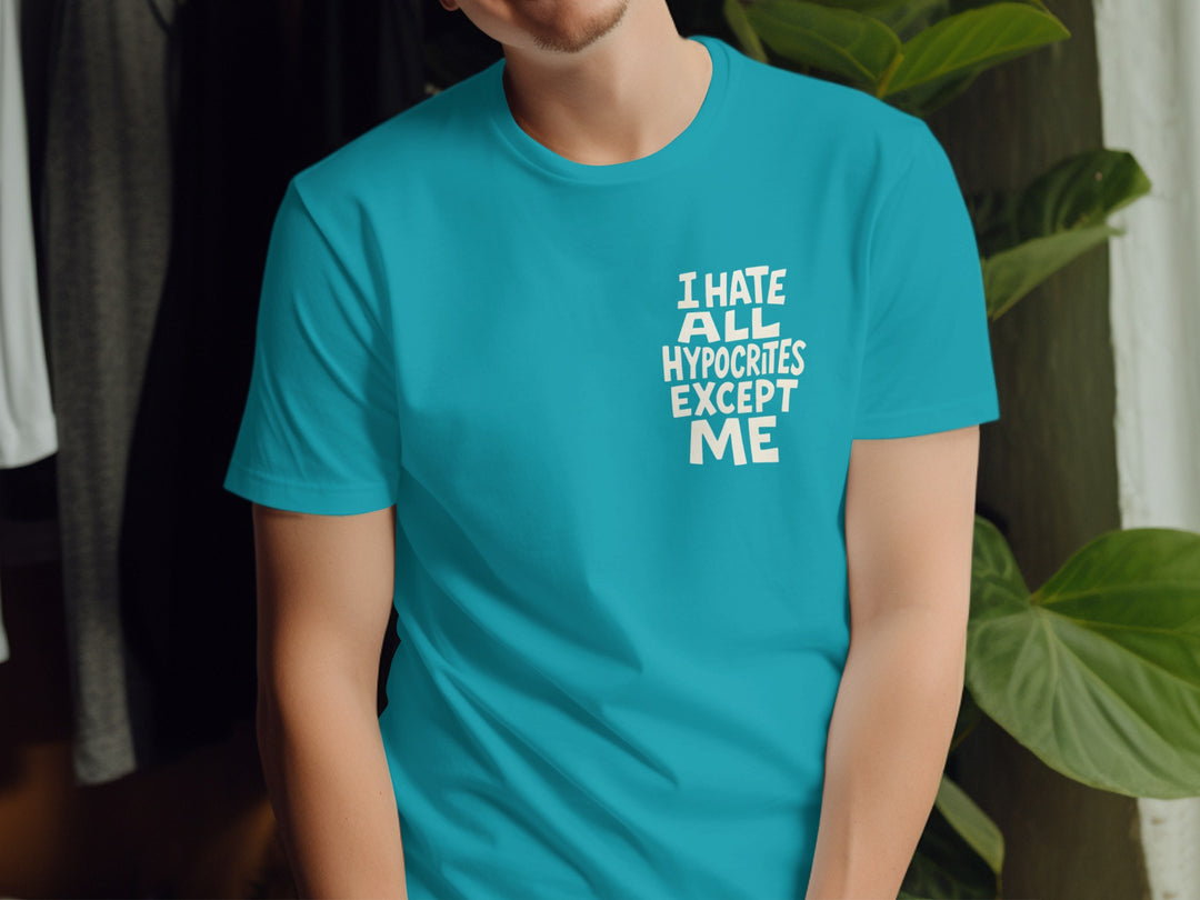 Person wearing a turquoise t-shirt with a humorous text design.
