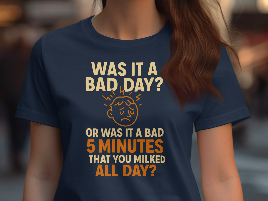 Person wearing a navy blue t-shirt with humorous text design.