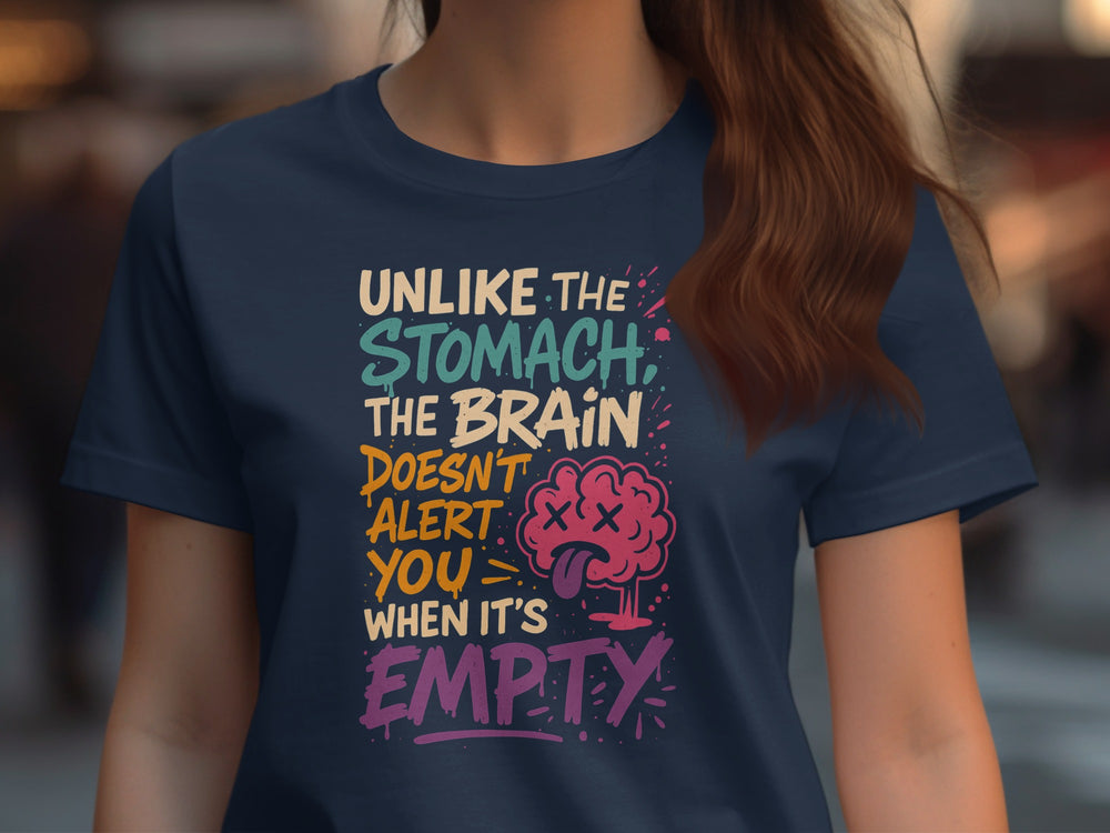 Person wearing a navy blue t-shirt with colorful text and brain graphic.