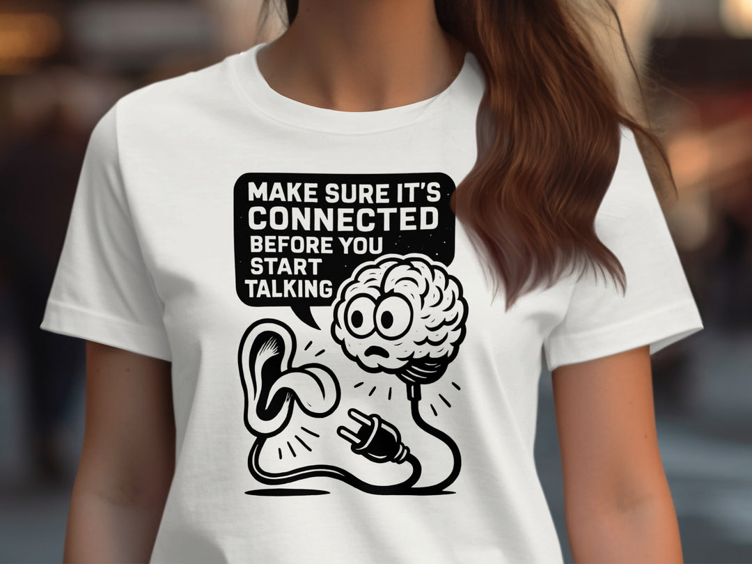 Off white t-shirt with a graphic design featuring a brain and ear, with text 'Make sure it's connected before you start talking'.