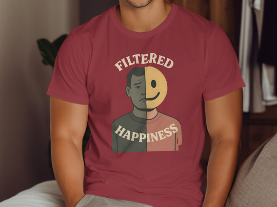 Person wearing a maroon t-shirt with a graphic design and text.