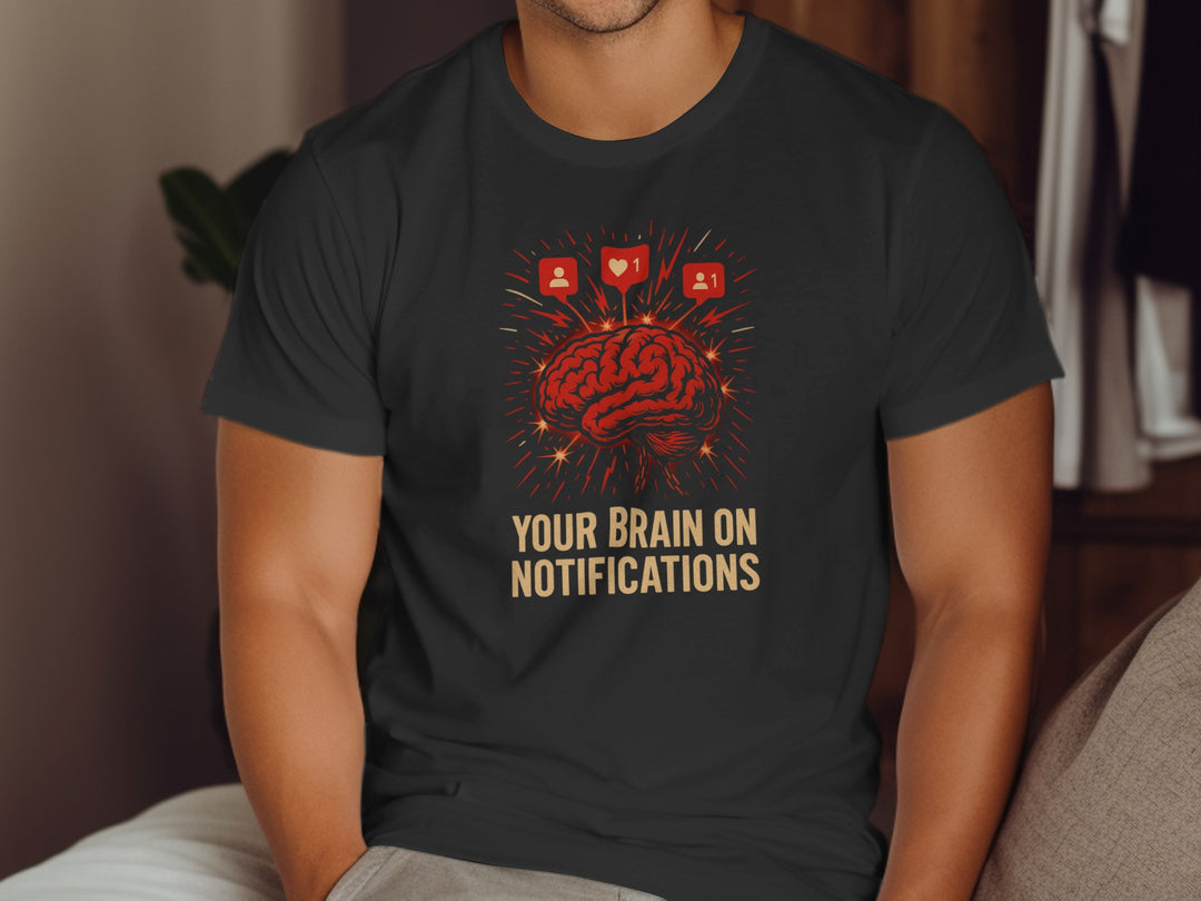 Person wearing a black t-shirt with a graphic design and text.
