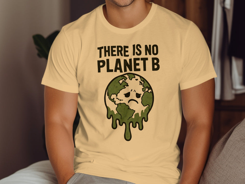 Person wearing a beige t-shirt with an environmental message graphic and text.