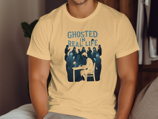 Person wearing a beige t-shirt with a graphic design and text.