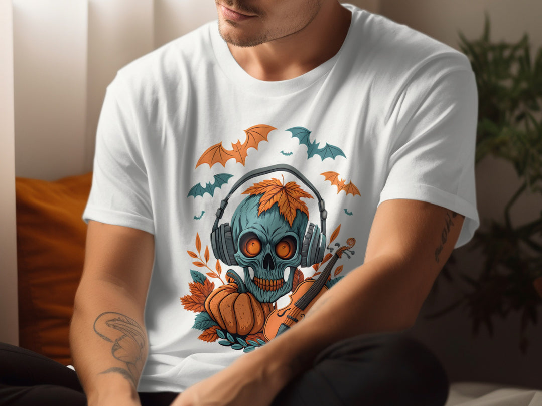 Person wearing a white t-shirt with a colorful skull design featuring headphones, pumpkins, and bats.