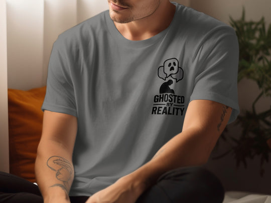 Person wearing a charcoal gray t-shirt with a graphic design and text.