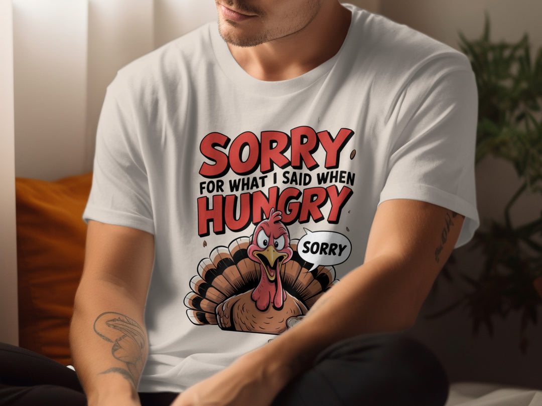 Person wearing a white t-shirt with a cartoon turkey graphic and text.