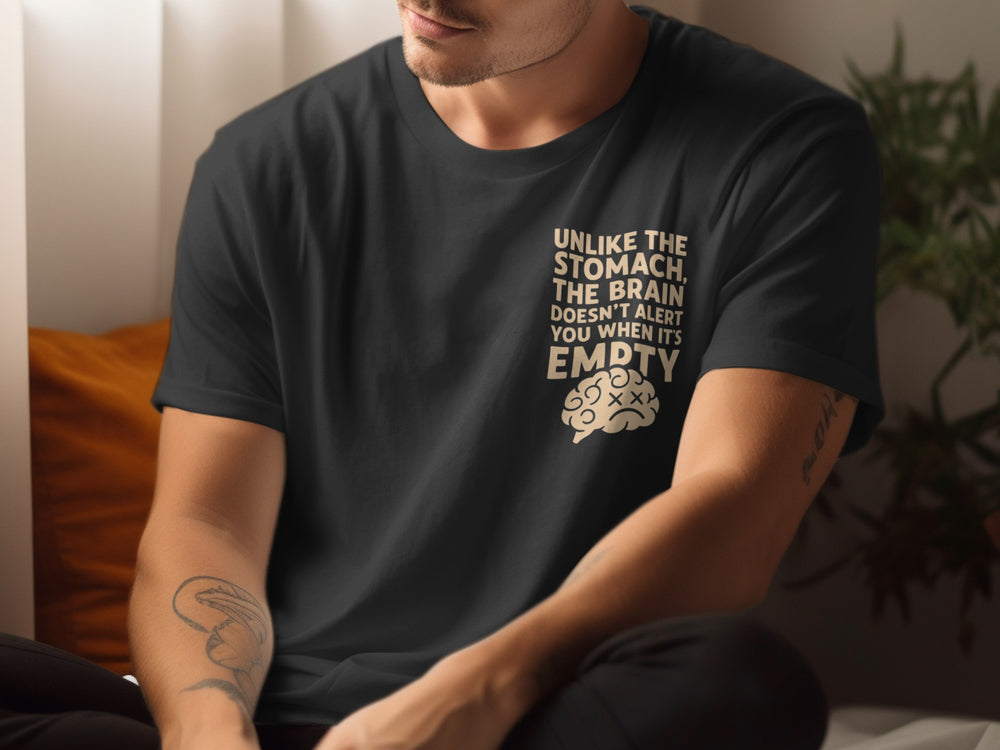 Person wearing a black t-shirt with a humorous graphic and text.