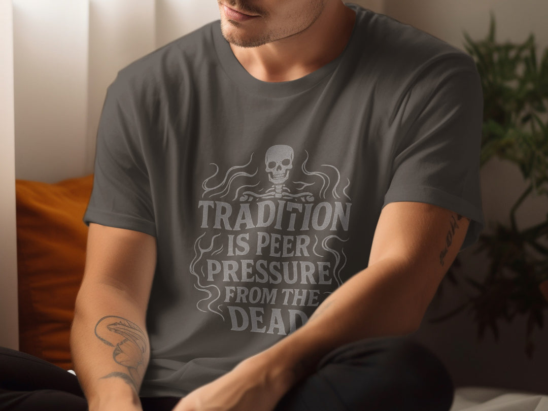 Person wearing a dark gray t-shirt with a skeleton design and text.