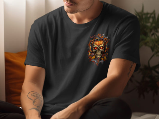 Person wearing a black t-shirt with a skull and pumpkin design.