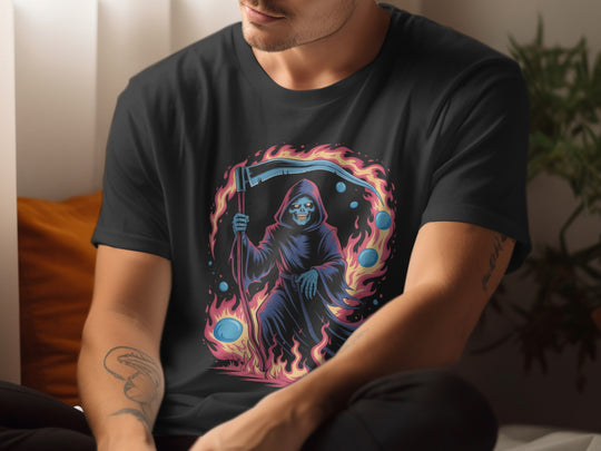 Person wearing a black t-shirt with a colorful graphic design of a reaper holding a scythe.