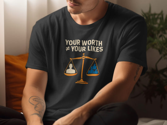 Person wearing a black t-shirt with a motivational message and graphic design.