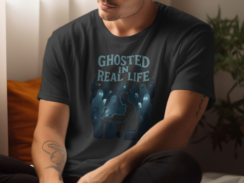 Person wearing a black t-shirt with 'Ghosted in Real Life' graphic design.
