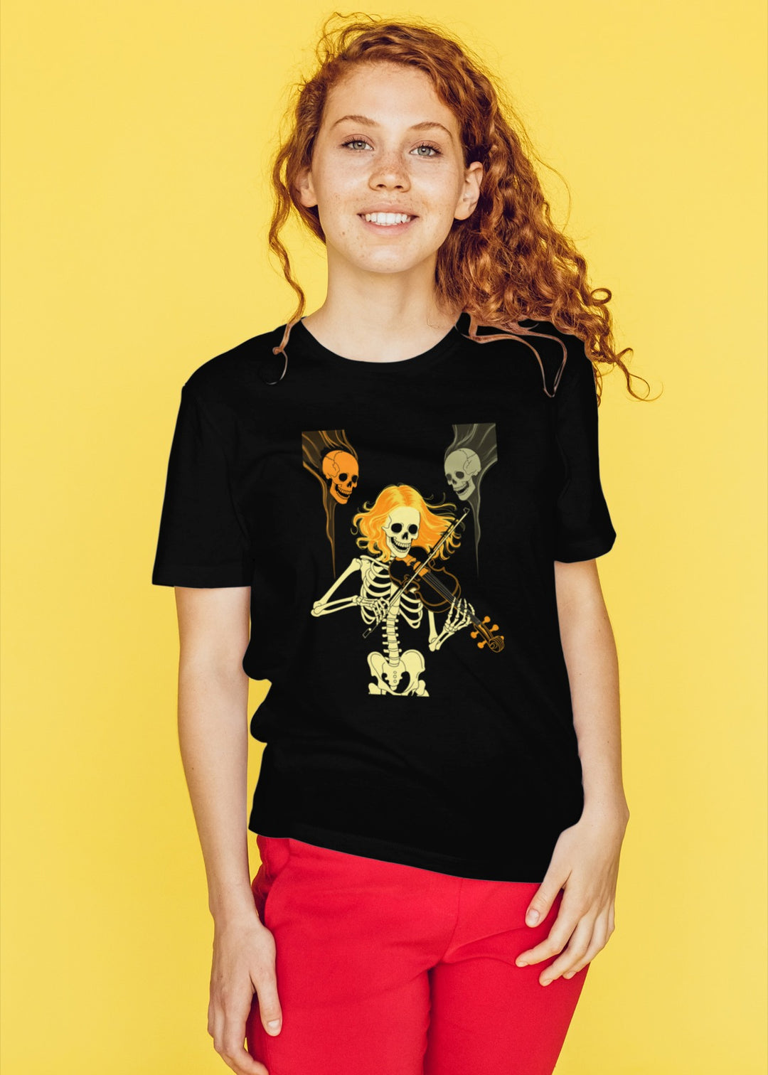 women's halloween t-shirt with ghostly violinist skeleton and floating skulls design