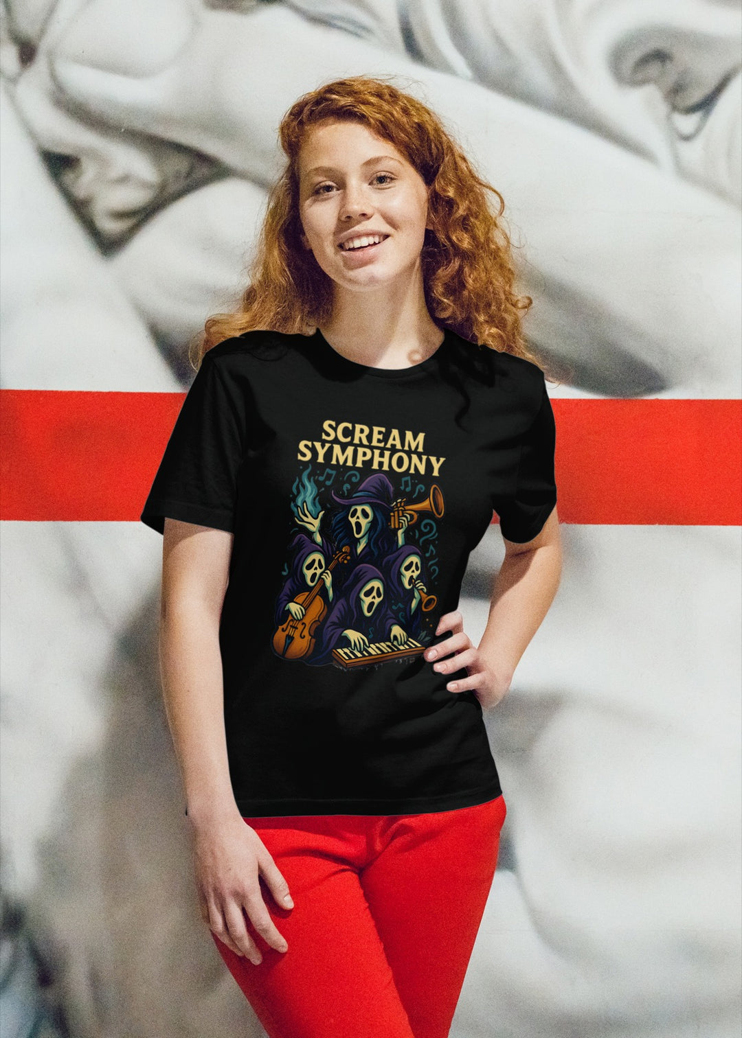 Women wearing a black t-shirt with 'Scream Symphony' design in front of a classical sculpture.