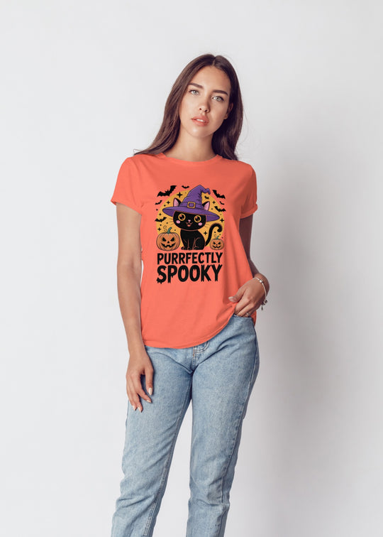 Woman wearing a Halloween-themed t-shirt with a black cat design on a plain background