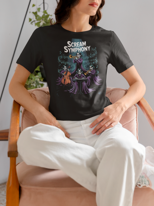 Women wearing a black t-shirt with 'Scream Symphony' design, sitting on a chair.