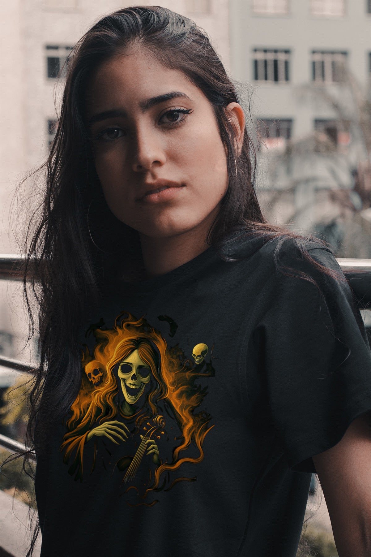 Women wearing a black t-shirt with a halloween graphic design in an urban setting